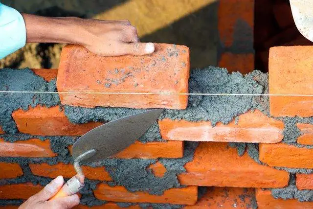 Laying block for a garden wall
