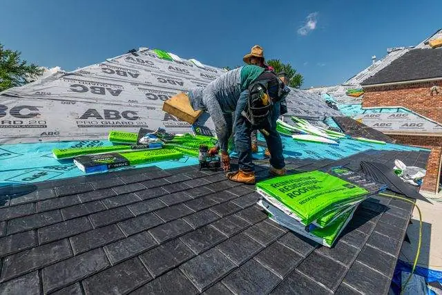Synthetic underlayment going down before the shingles